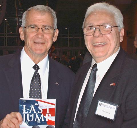 John E. Nevola with Col. Ollie North